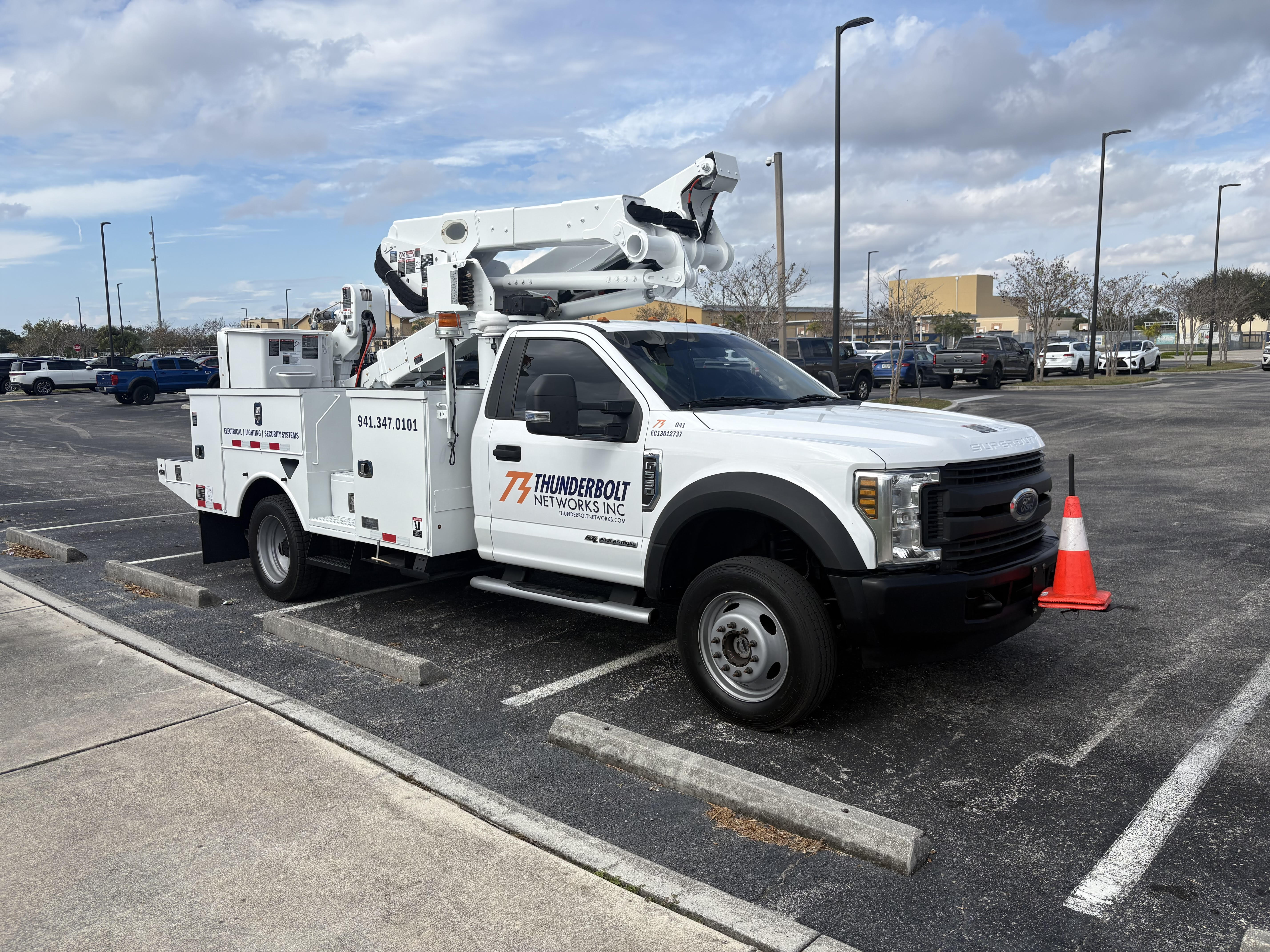 Thunderbolt Networks bucket truck at a job site
